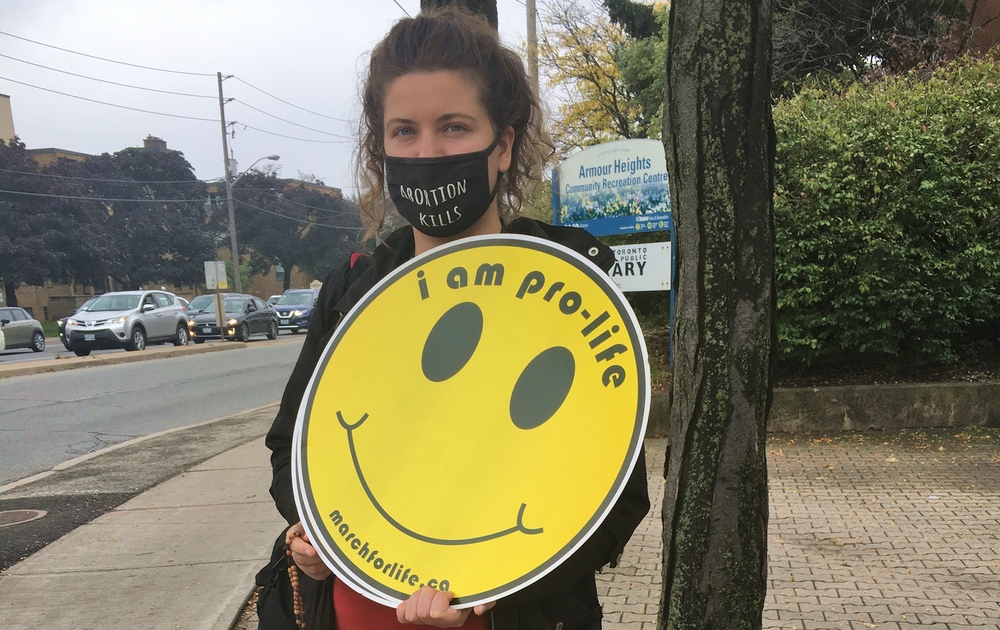 Josie-with-yellow-pro-life-sign